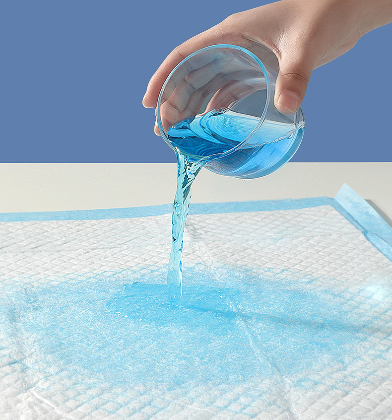 Absorbent incontinence care pad demonstrating liquid absorption capability